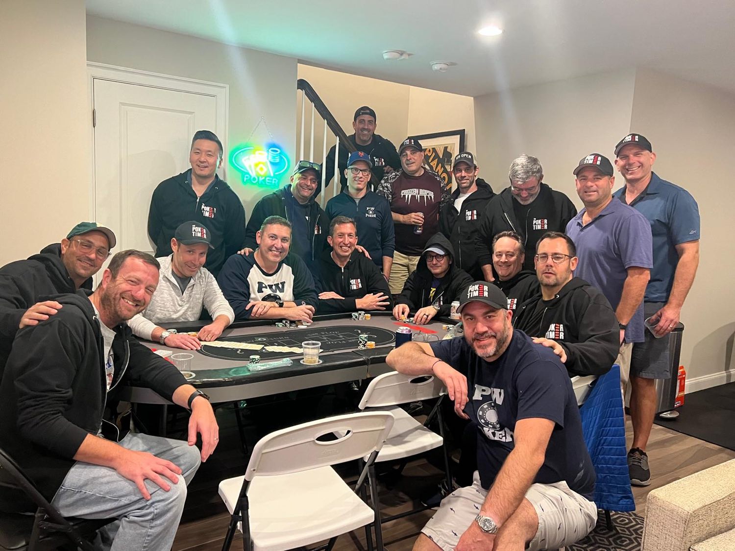 The Port Washington Poker Club gathered around a home poker table in Poker Timer gear
